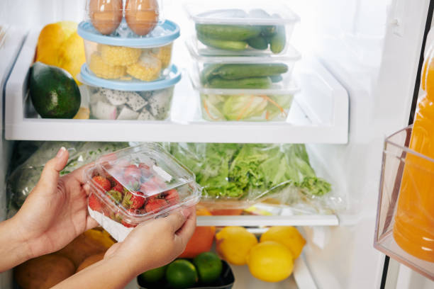 istock Housewife putting berries in fridge 1223224137