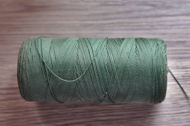 istock large spool of strong green thread 1223224138