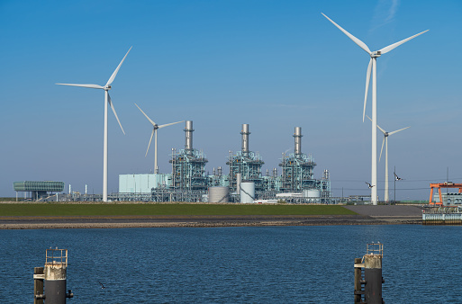 Modern multi-fuel power station and wind turbines at seaport Eemshaven.