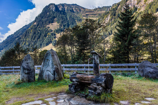 Lawn near the road. Grossglockner sightseeing Alpine Road. Austria. The roadside is fenced. Ecological and photo tourism conceptLawn near the road