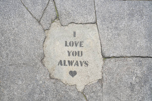I love you always words written on a concrete sidewalk