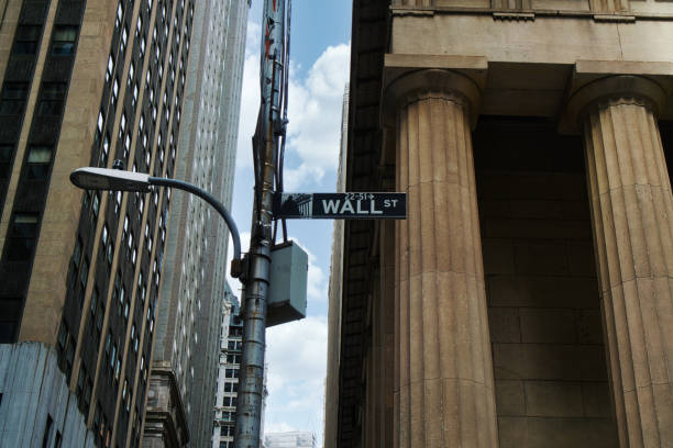 Road sign of New York Wall street corner Broad street Road sign of New York Wall street corner Broad street wall street lower manhattan stock pictures, royalty-free photos & images
