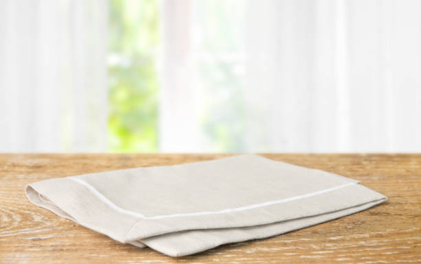 istock Beige cotton napkin on a wooden table 1223226512