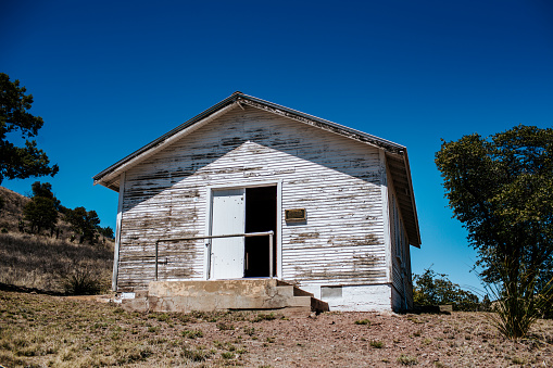 outside of a white washed one room school house in Tucson, AZ, United States