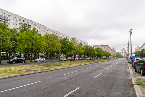 Berlin, Germany - May 3, 2020: Communist-era architecture on an empty Karl-Marx-Allee in the former East Berlin, Germany