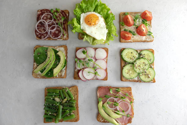 istock assorted vegetable and meat sandwiches with creamy spread on a gray concrete background 1223230584