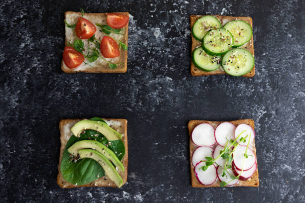 istock four vegan toasts with vegetables and microgreens on whole grain bread, 1223230641