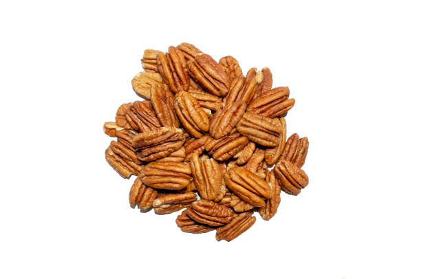 Peeled pecan nuts isolated on white background stock photo