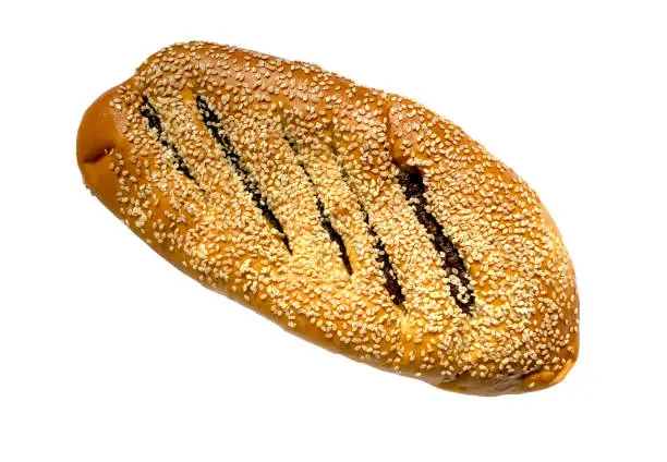 Photo of Ma'arook bread with date fruit and sesame seeds isolated on white background