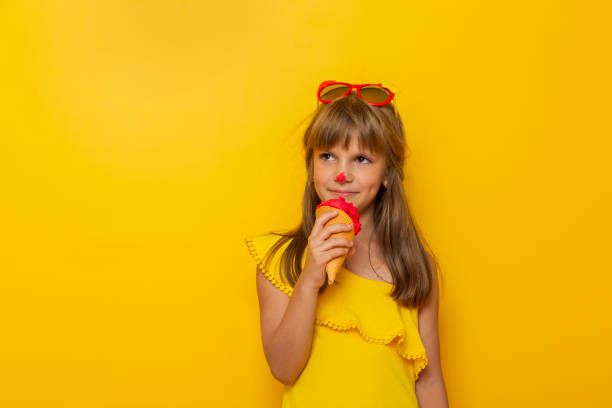 istock Little girl eating ice cream 1223231097