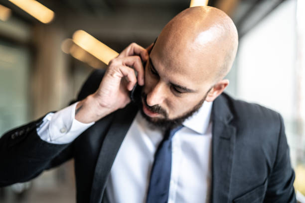 istock Businessman worried while talking on the phone 1223232961