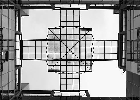The glass roof of the building in the form of different-sized squares. Symmetry.