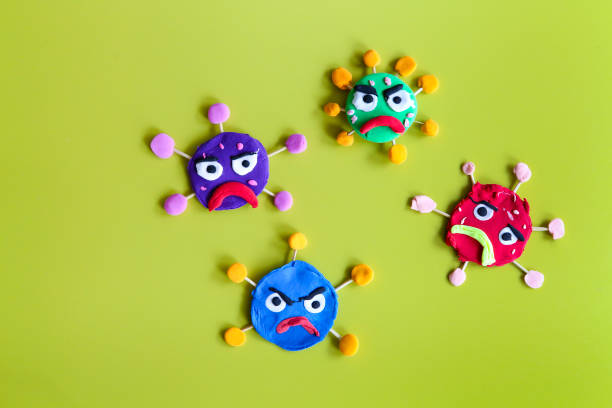 istock Clay characters on yellow background. Corona virus or covid-19 1223233798