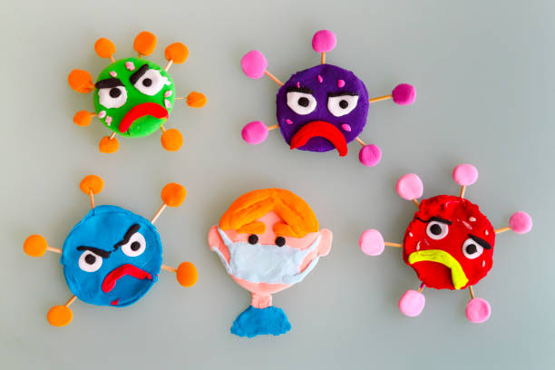 istock Clay characters on gray background. Corona virus or covid-19 1223233971