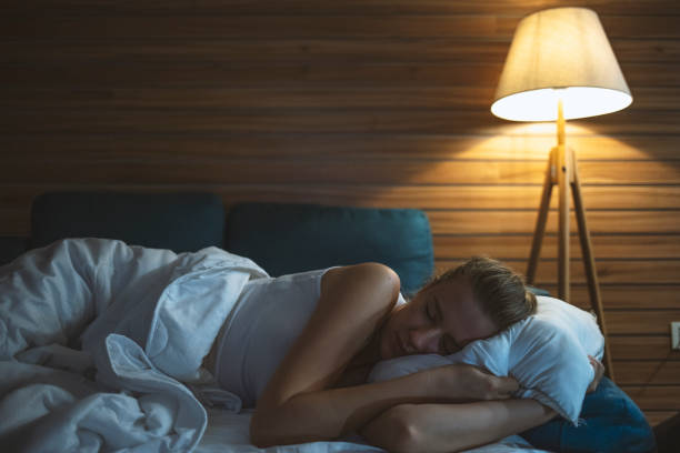 istock Young woman sleeping in bed 1223233992