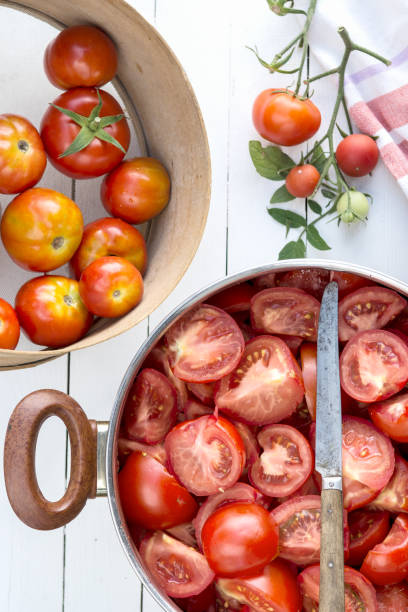 istock Sliced tomatoes in the pot,  tomatoes are prepared for preserves 1223234246