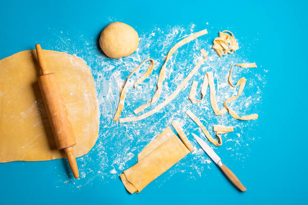 istock Making pasta tagliatelle by hand. Artisan pasta. Raw dough 1223234594