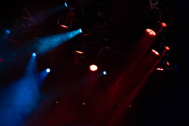 istock lights spotlights and smoke over the stage 1223235214