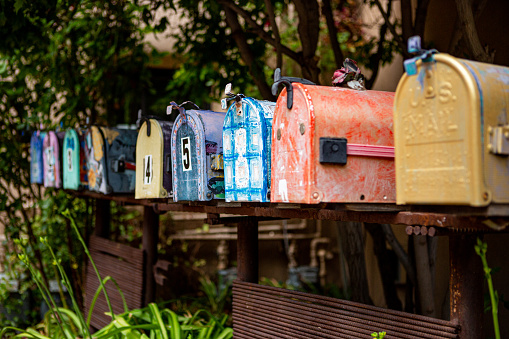 Row of painted mailboxes along Canyon Road in Santa Fe, New Mexico - southwest USA
