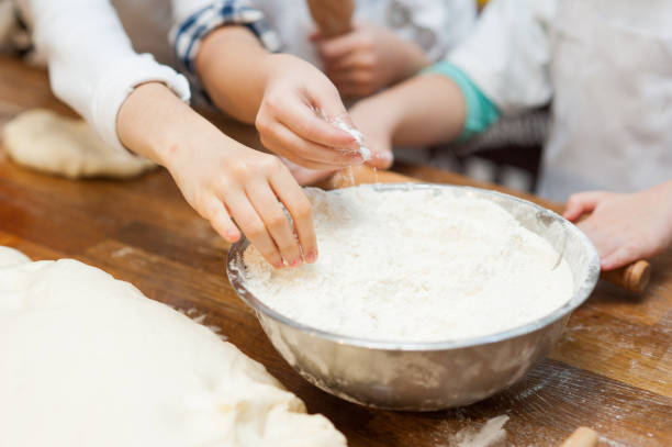 istock Young children make dough products. Hands closeup 1223235523