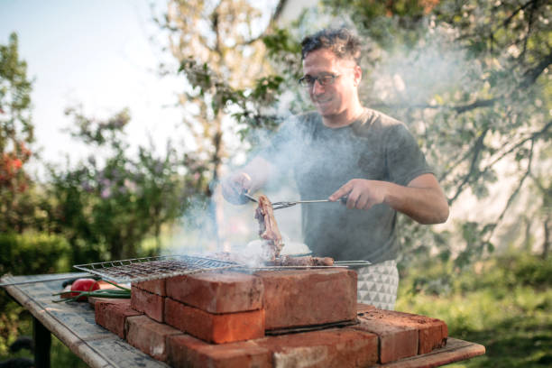istock Preparing barbecue food for garden party 1223236381