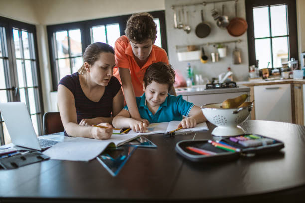 istock Mother homeschooling boys from home 1223236437