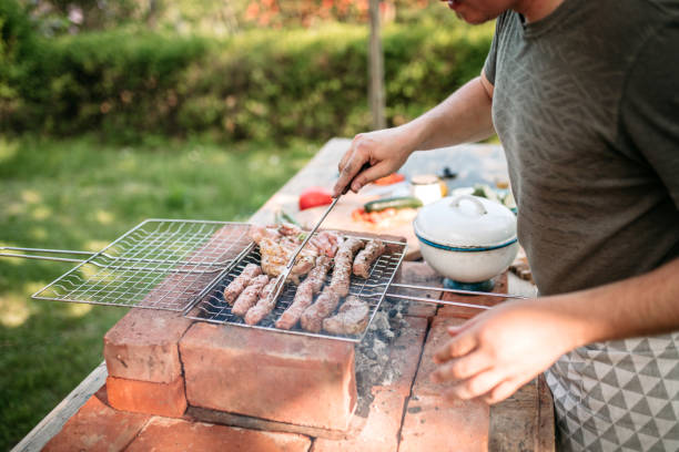 istock Preparing barbecue food for garden party 1223237127