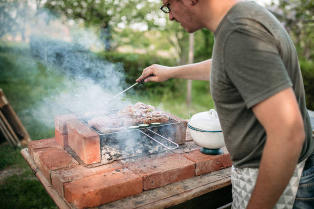 istock Preparing barbecue food for garden party 1223237283