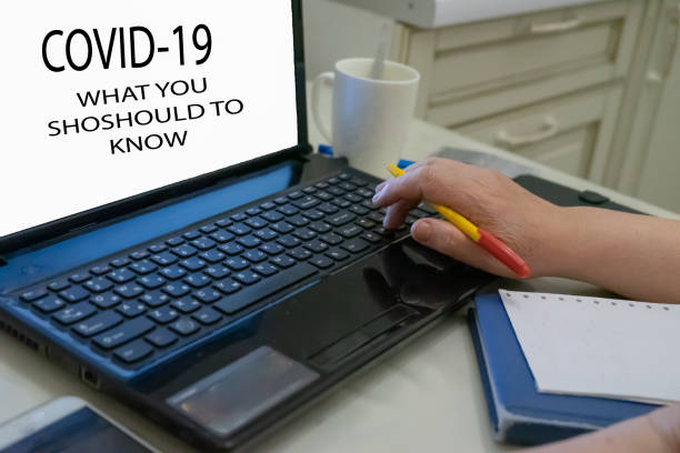 istock Female hands typing on the laptop keyboard, woman's hands using laptop in interior. COVID-19 1223237525