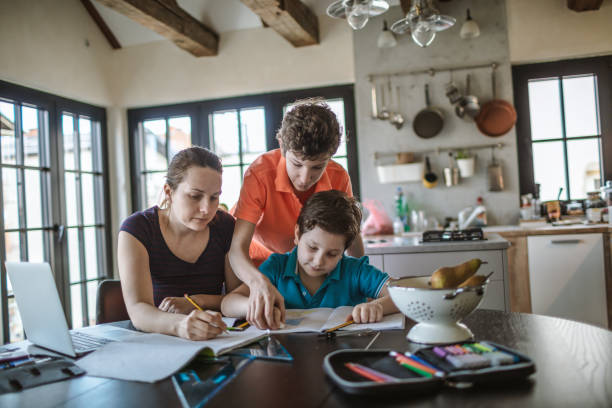 istock Mother homeschooling boys from home 1223237672