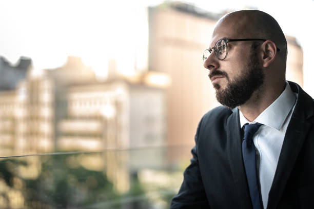 istock Businessman looking away from his office 1223237716