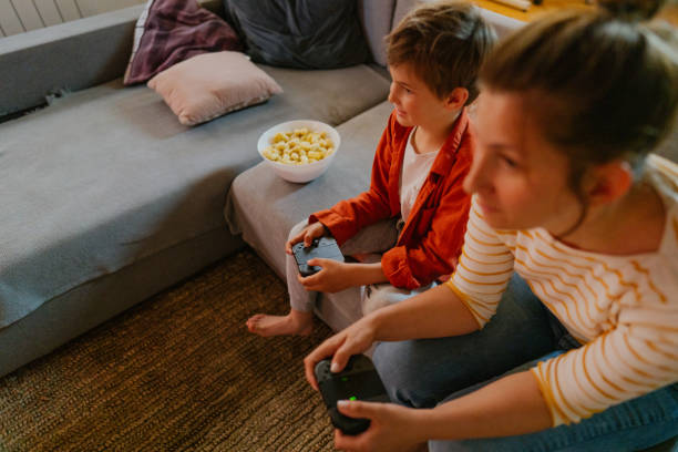 istock Mother and son playing video games at home 1223238736