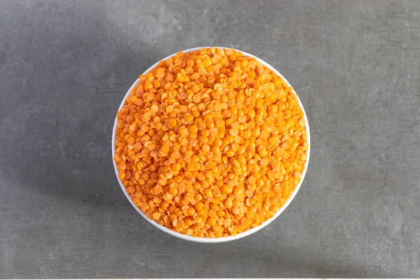 istock Bowl of Dhal seeds top view Neutral background with negative space to add caption 1223238940