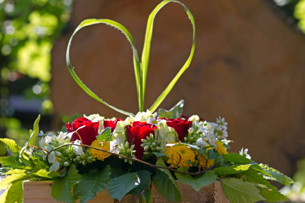 Bouquet of pink roses in a heart shaped vase, top view isolated nature background with clipping path