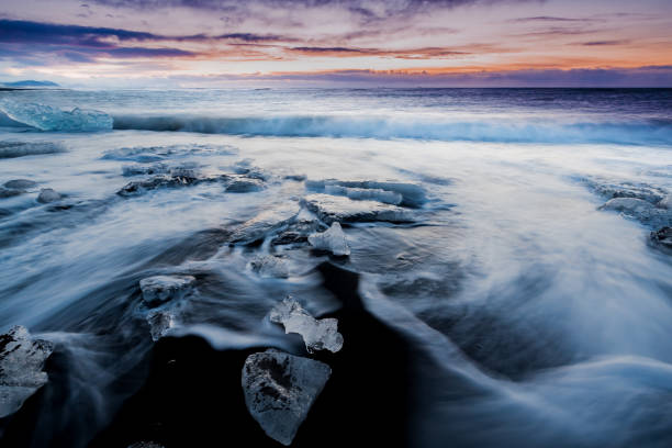 istock Black Ice beach at Jokulsarlon at sunrise 1223239413
