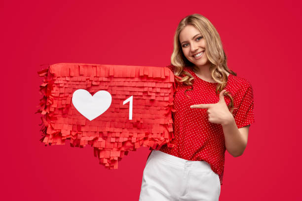 istock Cheerful female influencer on red background 1223240245
