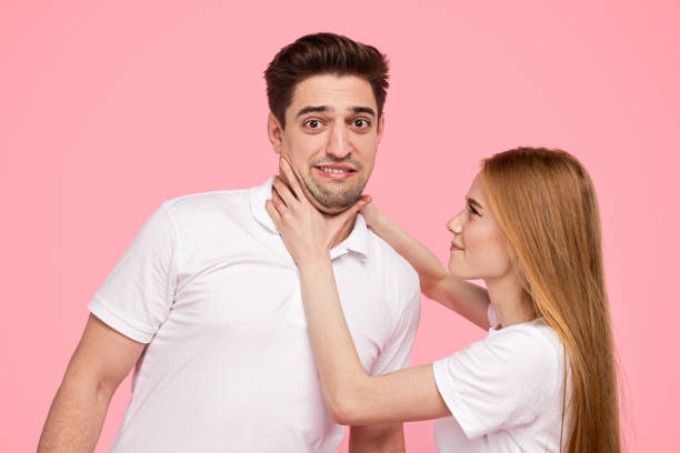 istock Angry woman chocking boyfriend during argument 1223240284