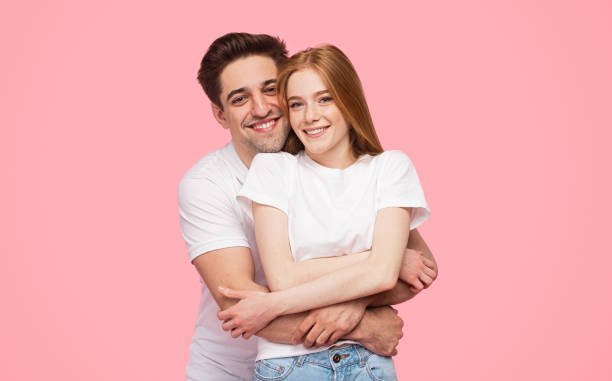 istock Delighted couple hugging and looking at camera 1223240293