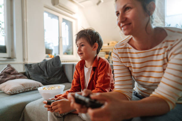 istock Mother and son playing video games at home 1223240357