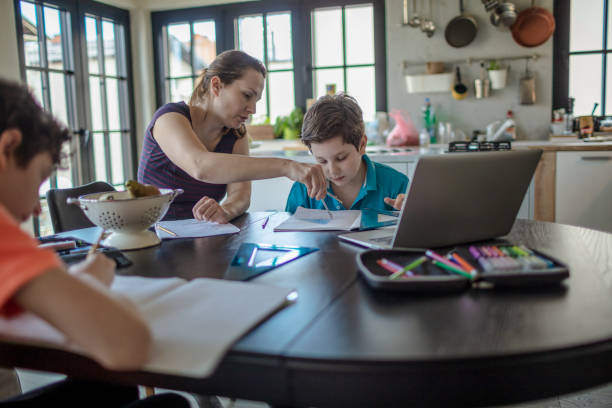 istock Mother homeschooling boys in self-isolation 1223240477