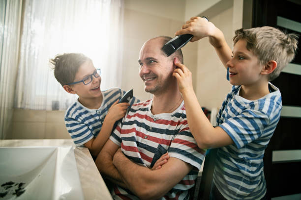 istock Little boys having fun cutting their father's hair 1223240932