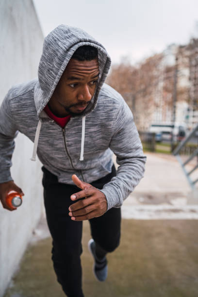 istock Sport man running up on stairs. 1223240973