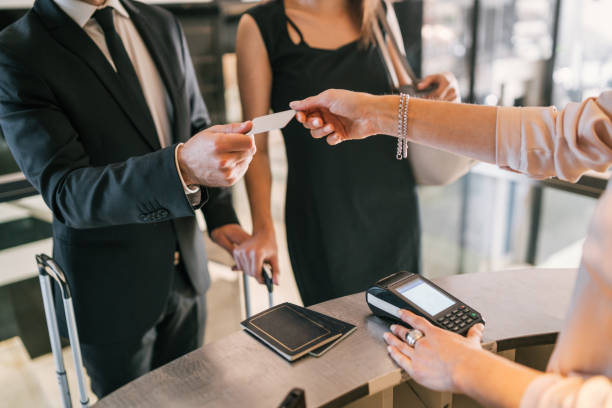 istock Business people makes card payment at check-in at reception. 1223241010