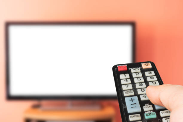 istock Caucasian man watching TV at home with white screen. 1223242746