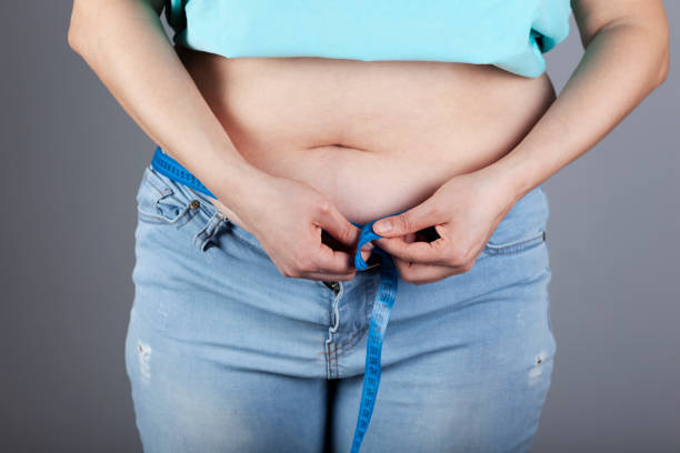 istock woman hand meter in belly 1223243737