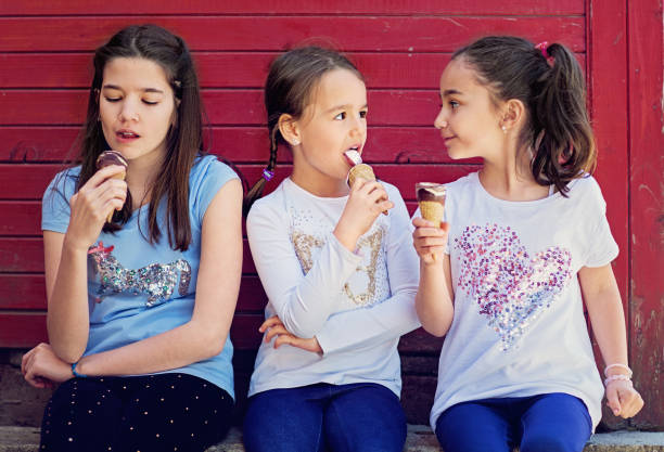 istock Girlfriends are eating ice cream and making fun together 1223245766