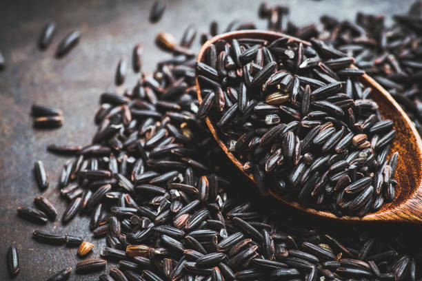 istock Raw black rice on the dark rustic background 1223247317