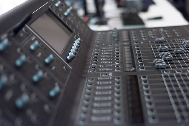Audio sound mixer console. Audio mixer, music equipment. broadcasting tools, mixer, synthesizer. and computer control.Professional sound and audio mixer control panel with buttons and sliders. consola mezcladora de sonido de audio. mezclador de audio, equipo de música. herramientas de radiodifusión, mezclador, sintetizador. y el control informático. panel de control profesional del mezclador de sonido y audio con botones y controles deslizant
