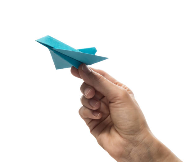 istock Blue paper plane in human palm. 1223250002