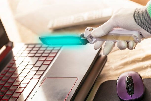 istock Prevent infection Covid 19 viruses or coronavirus And various pathogens, disinfection of objects with a disinfector, portable ultraviolet disinfection and its application in action 1223250626